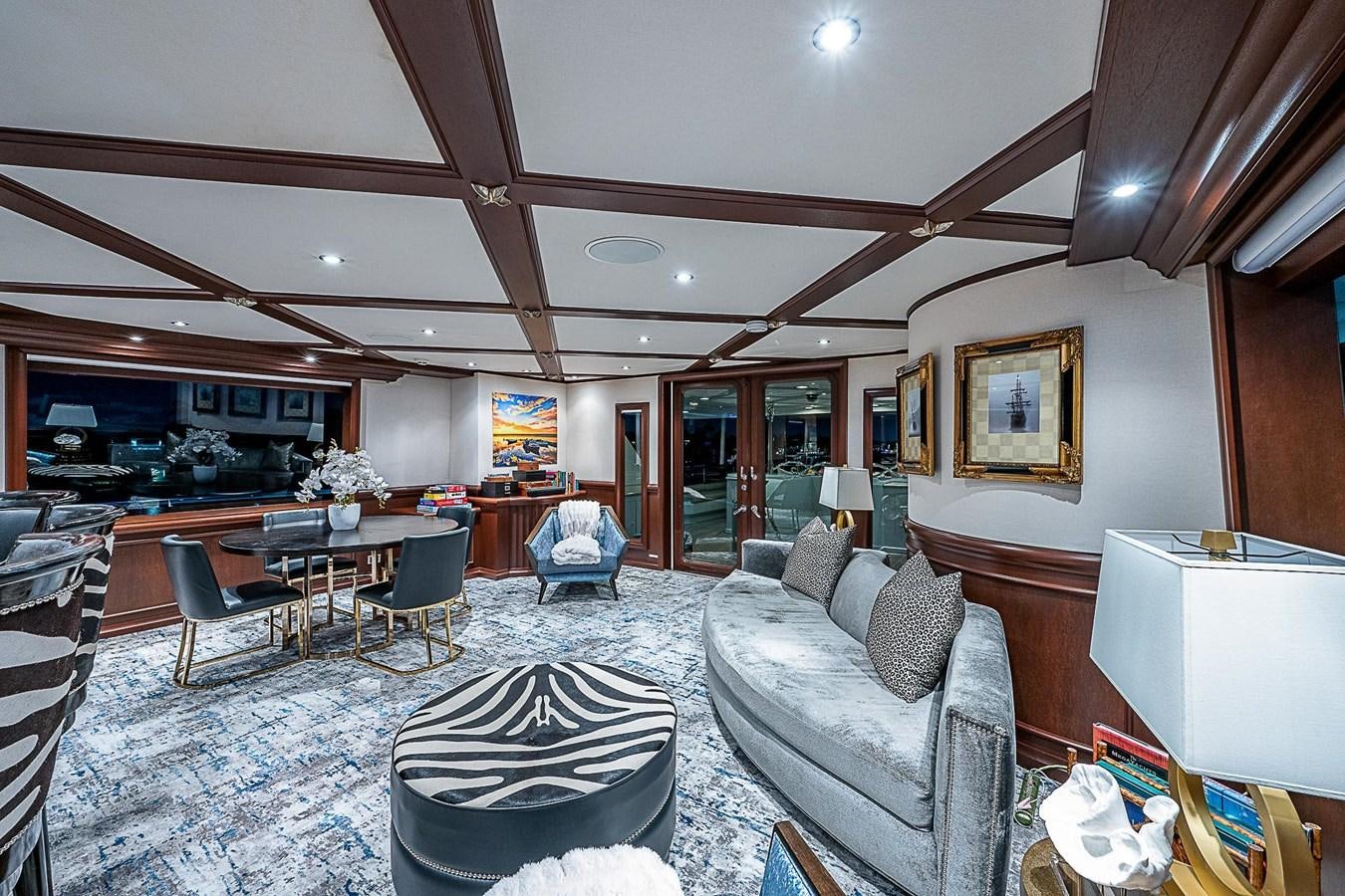 a living room with a large rug aboard LAGNIAPPE Yacht for Sale