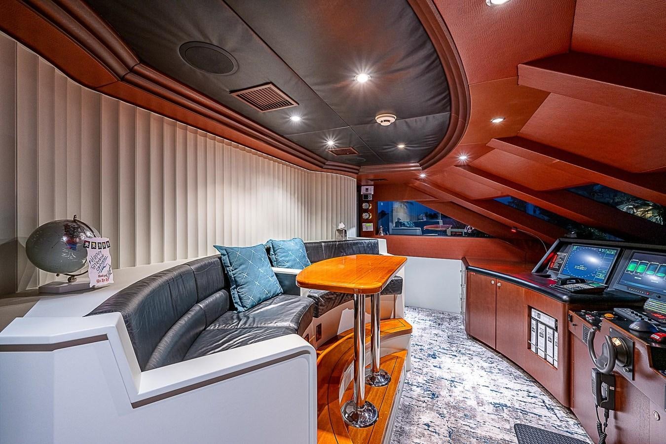 a room with a couch and a table aboard LAGNIAPPE Yacht for Sale