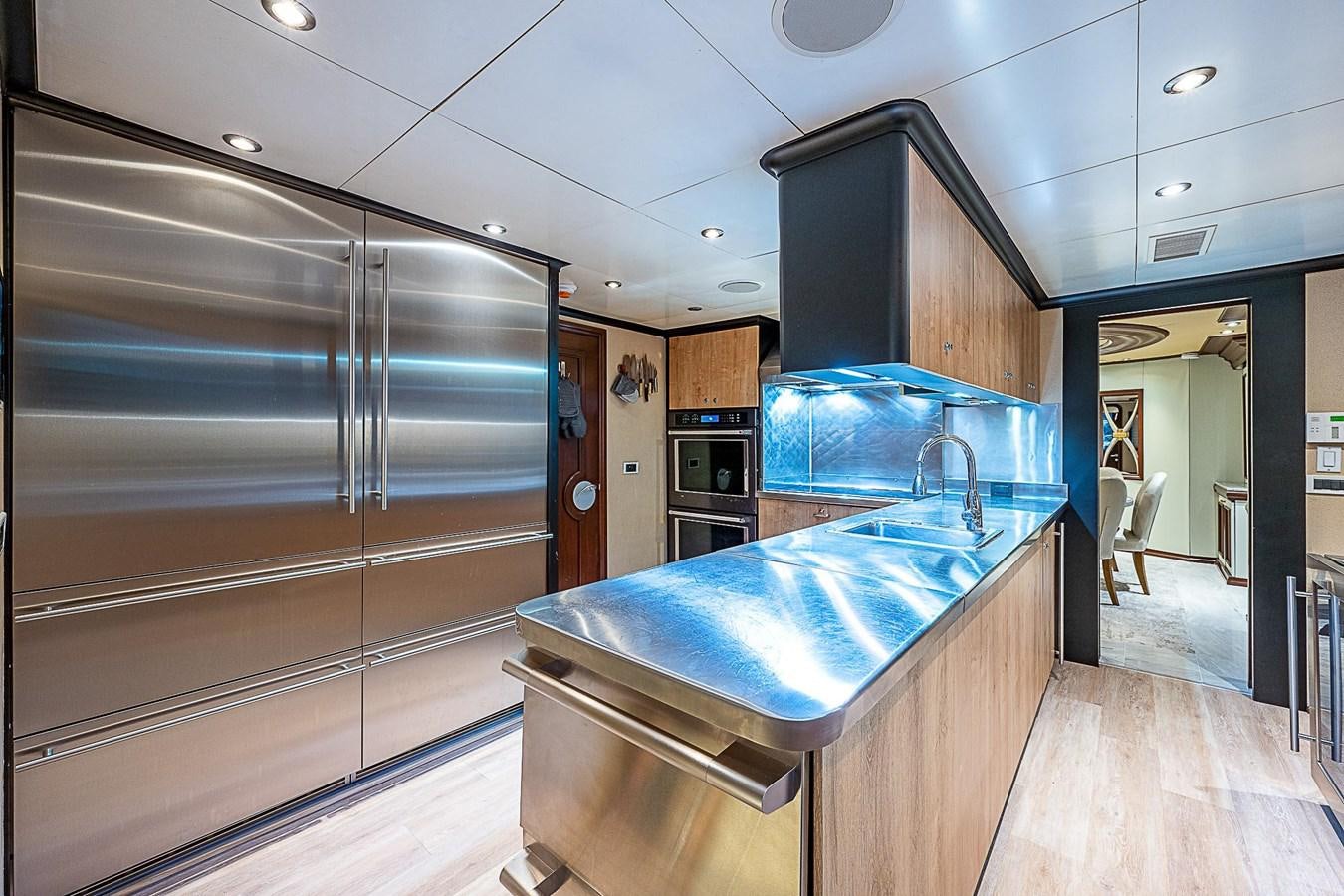 a kitchen with a large island aboard LAGNIAPPE Yacht for Sale