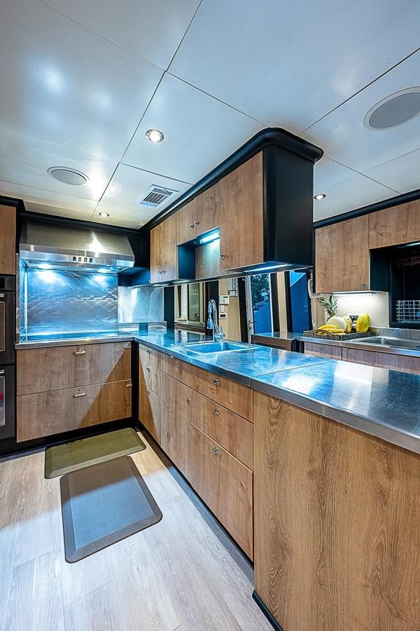 a kitchen with a large island aboard LAGNIAPPE Yacht for Sale