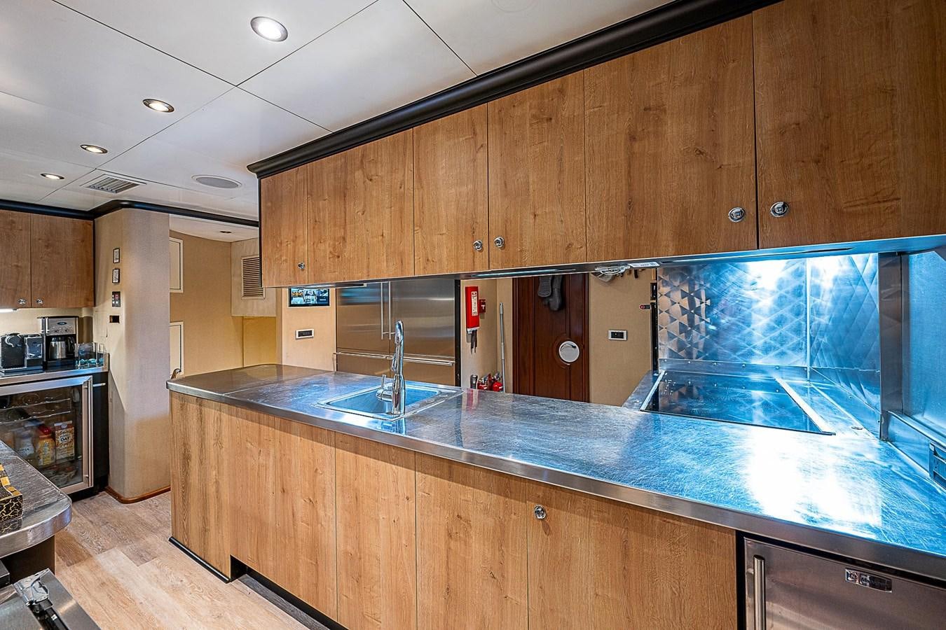 a kitchen with a large glass window aboard LAGNIAPPE Yacht for Sale