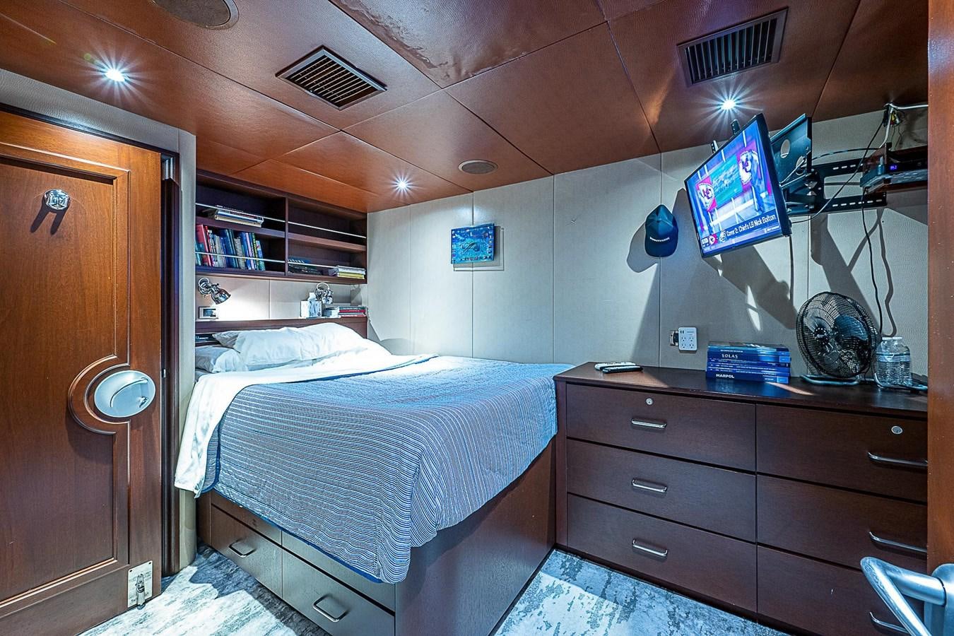 a bedroom with two beds aboard LAGNIAPPE Yacht for Sale