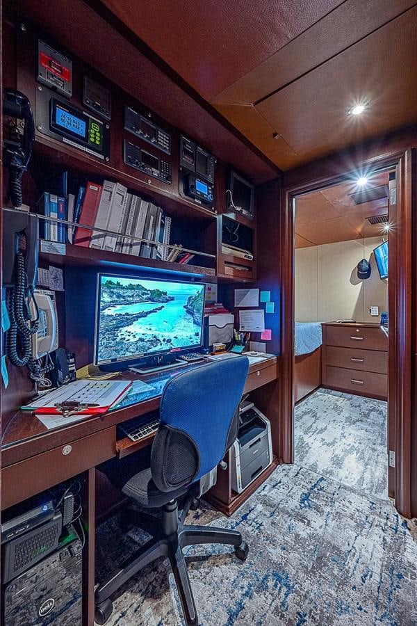 a computer on a desk aboard LAGNIAPPE Yacht for Sale