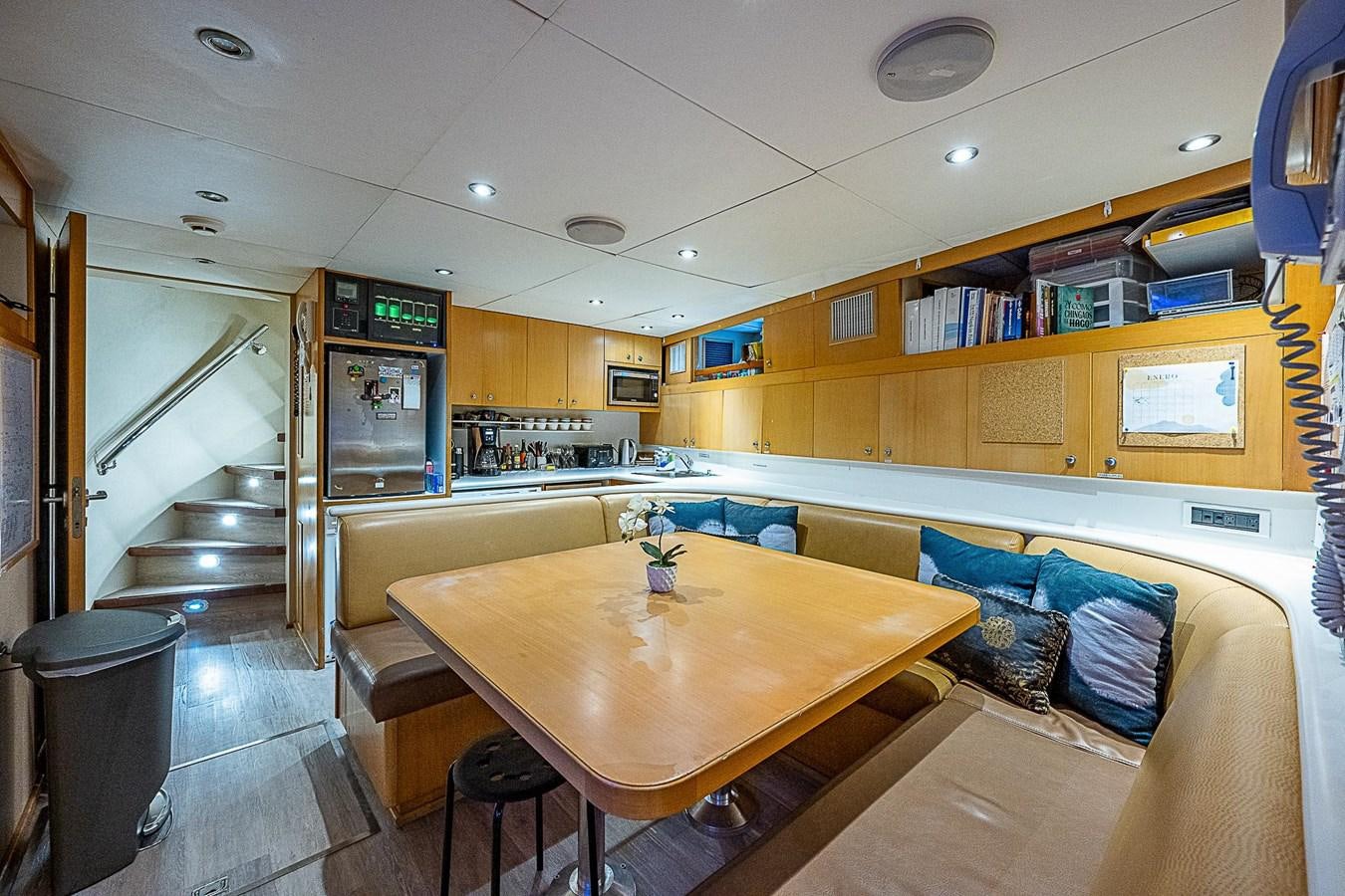 a room with a table and chairs aboard LAGNIAPPE Yacht for Sale