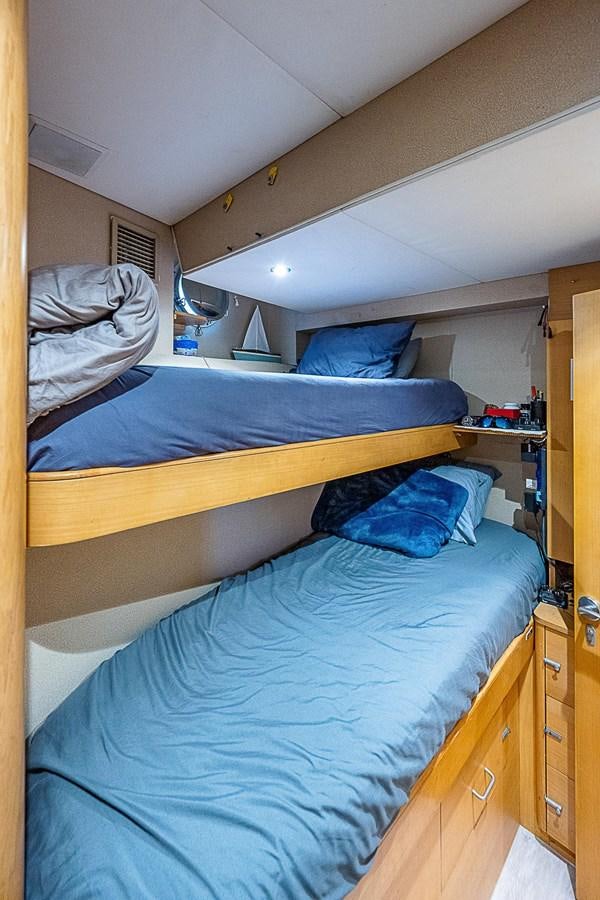 a couple of beds in a room aboard LAGNIAPPE Yacht for Sale