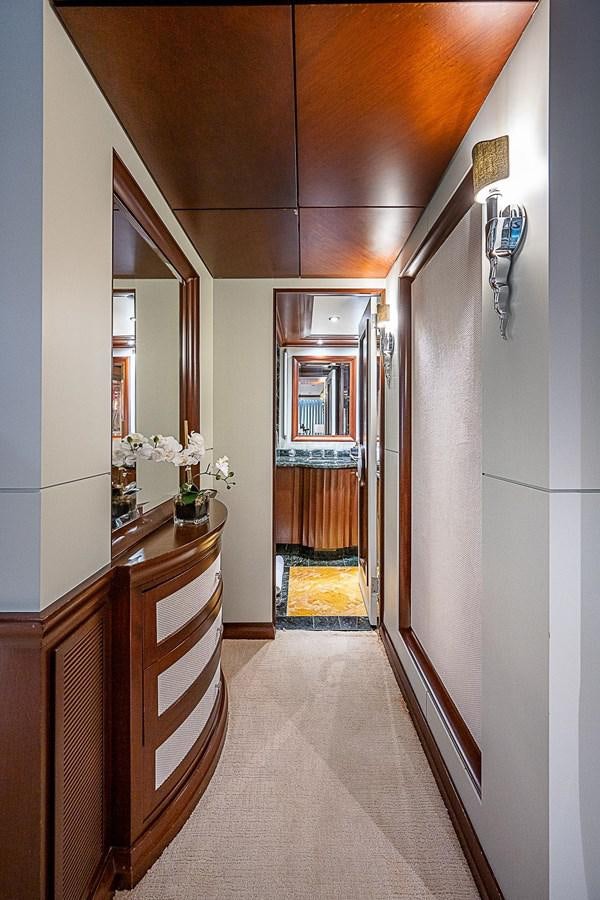 a hallway with a door and a mirror aboard LAGNIAPPE Yacht for Sale