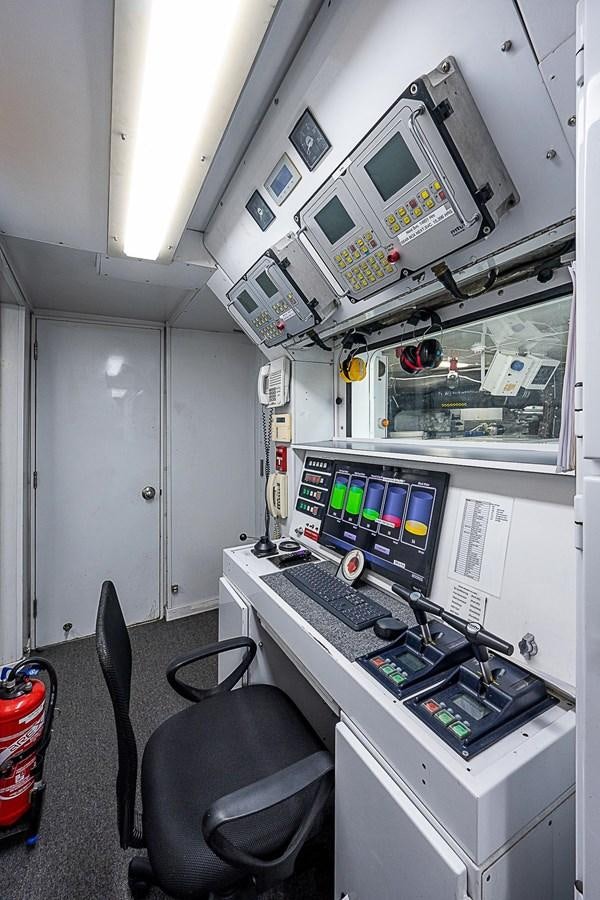 a control room with a computer aboard LAGNIAPPE Yacht for Sale
