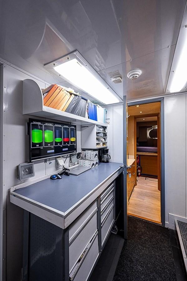 a room with a desk and computer aboard LAGNIAPPE Yacht for Sale