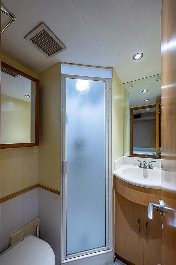 a bathroom with a shower unit and sink aboard LAGNIAPPE Yacht for Sale