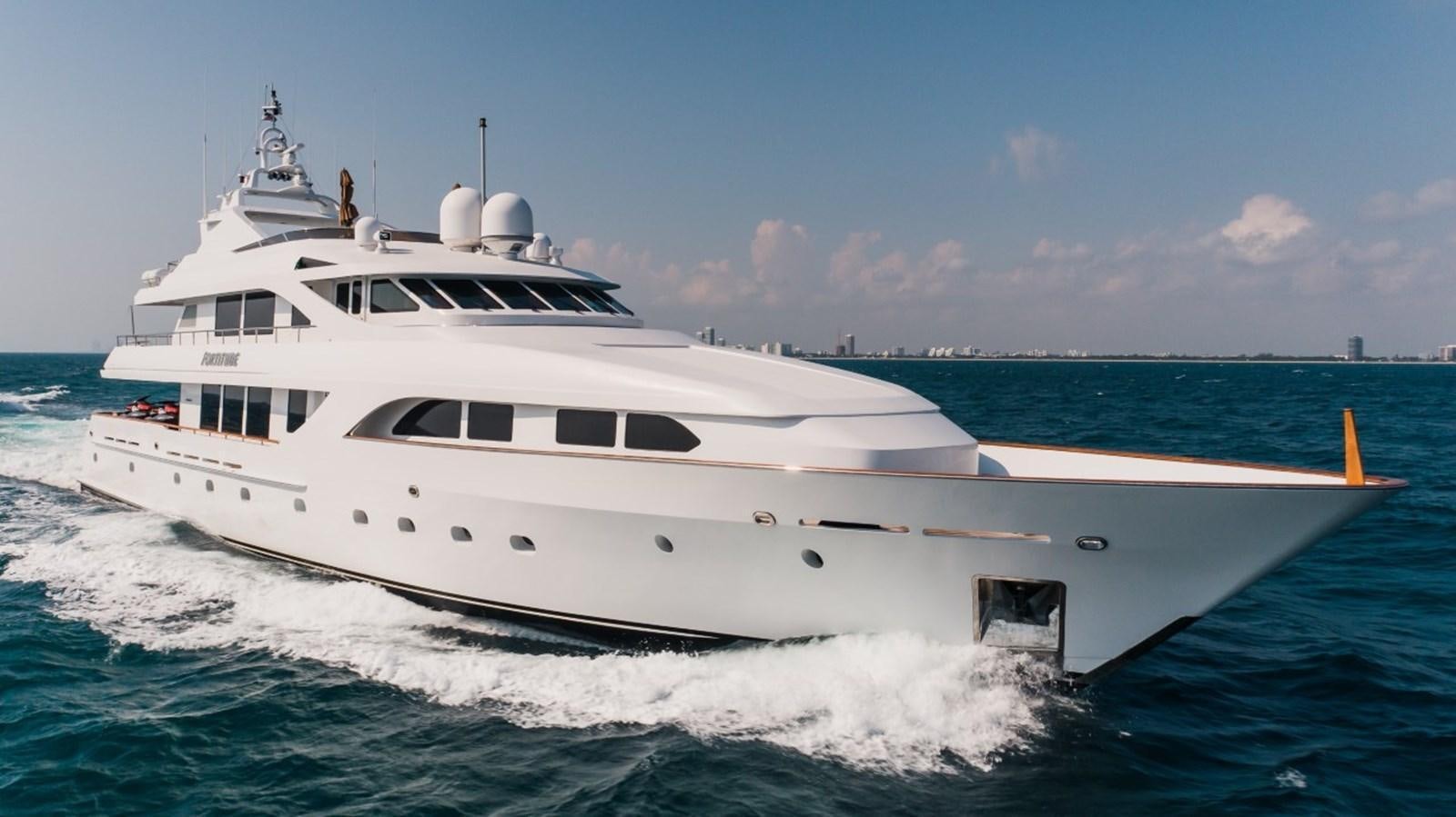 a white yacht on the water aboard LAGNIAPPE Yacht for Sale