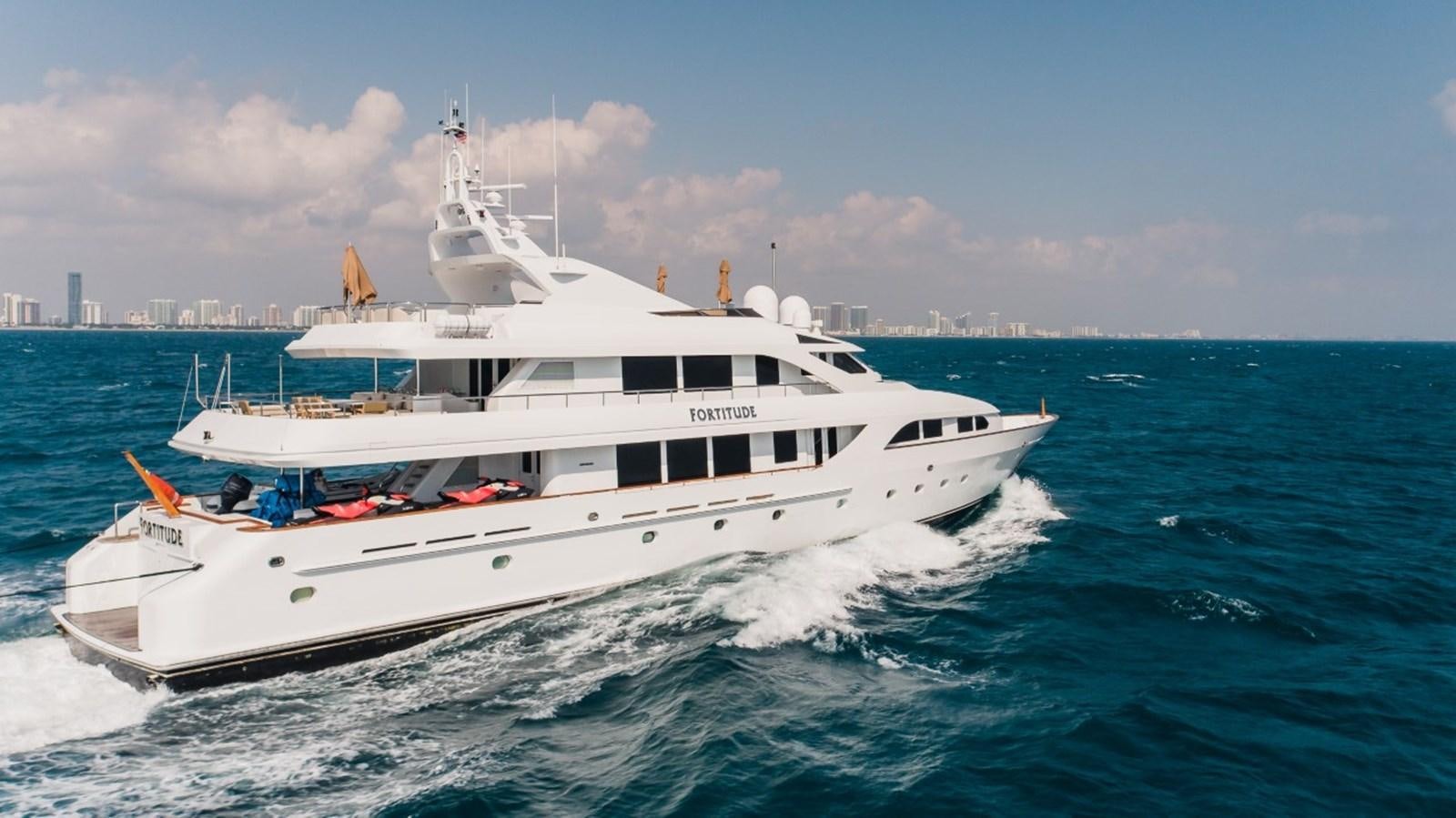 a white boat on the water aboard LAGNIAPPE Yacht for Sale