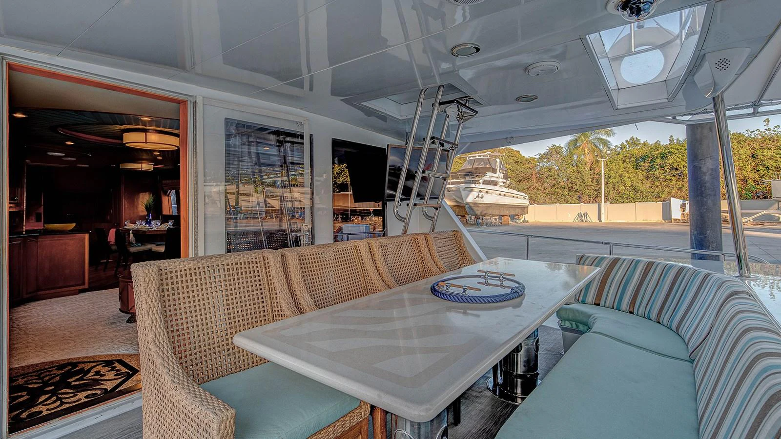 a table and chairs in a room aboard SIR JON II Yacht for Sale