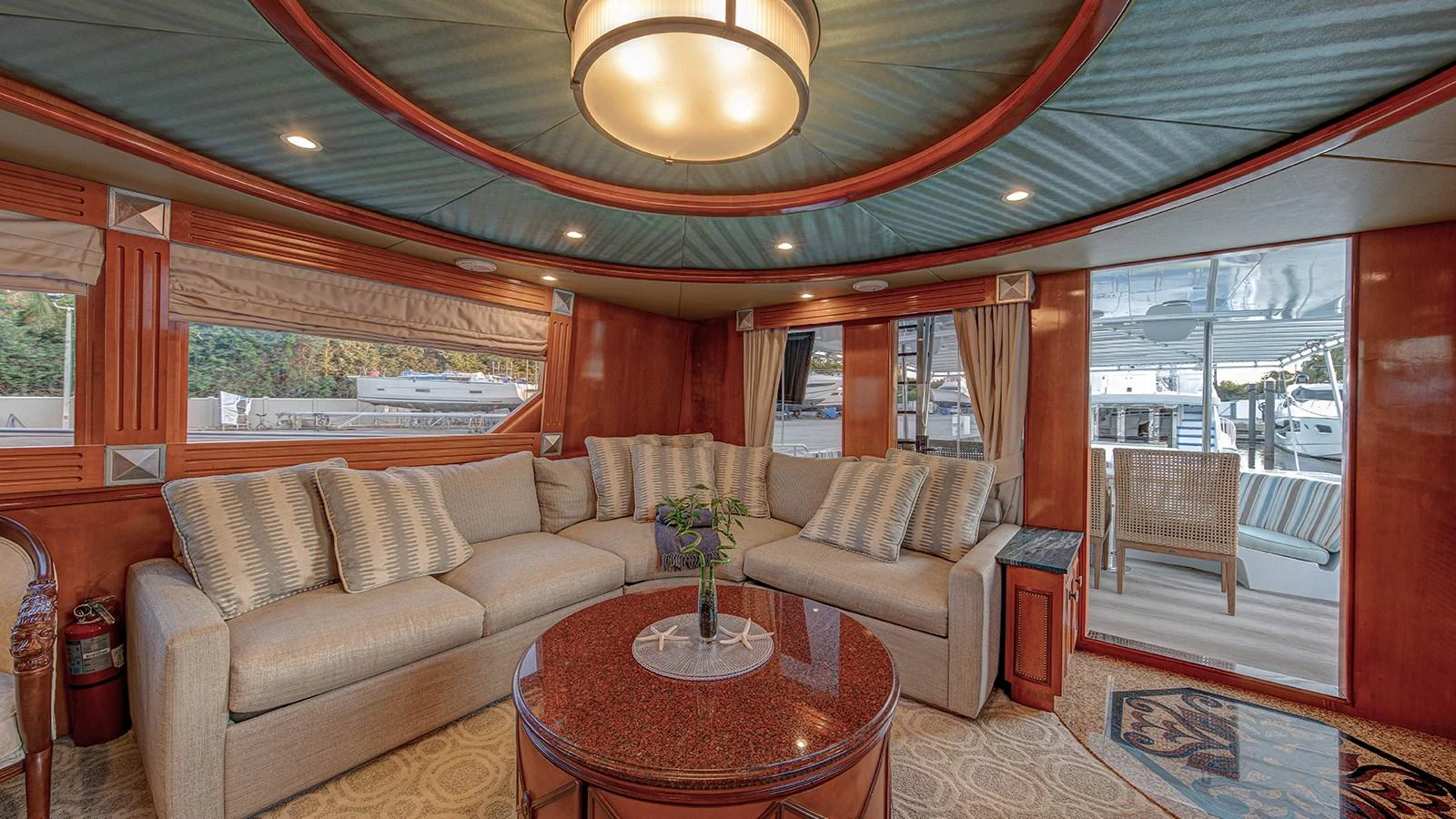 a living room with a couch and a table aboard SIR JON II Yacht for Sale