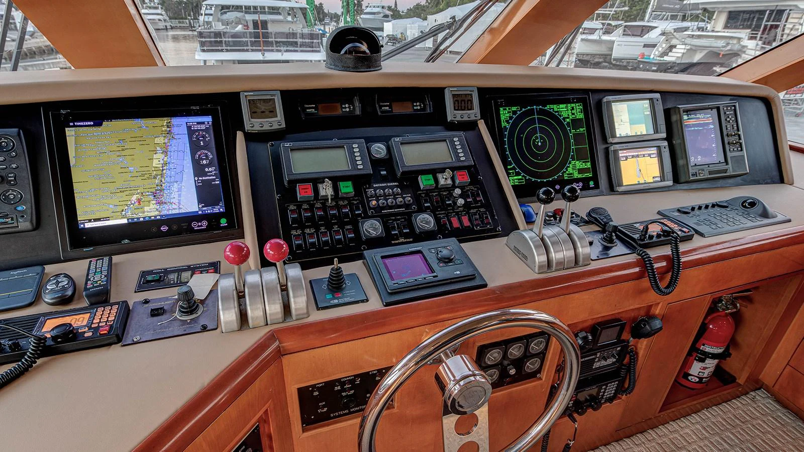 a desk with electronic devices aboard SIR JON II Yacht for Sale