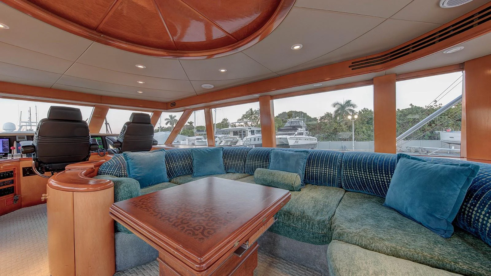 a living room with a couch and a table aboard SIR JON II Yacht for Sale
