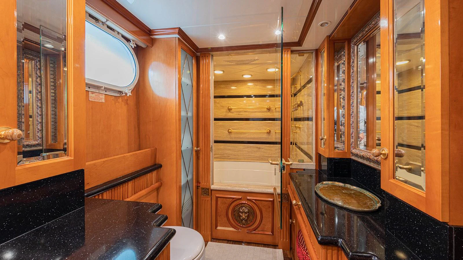 a bathroom with a large glass shower aboard SIR JON II Yacht for Sale