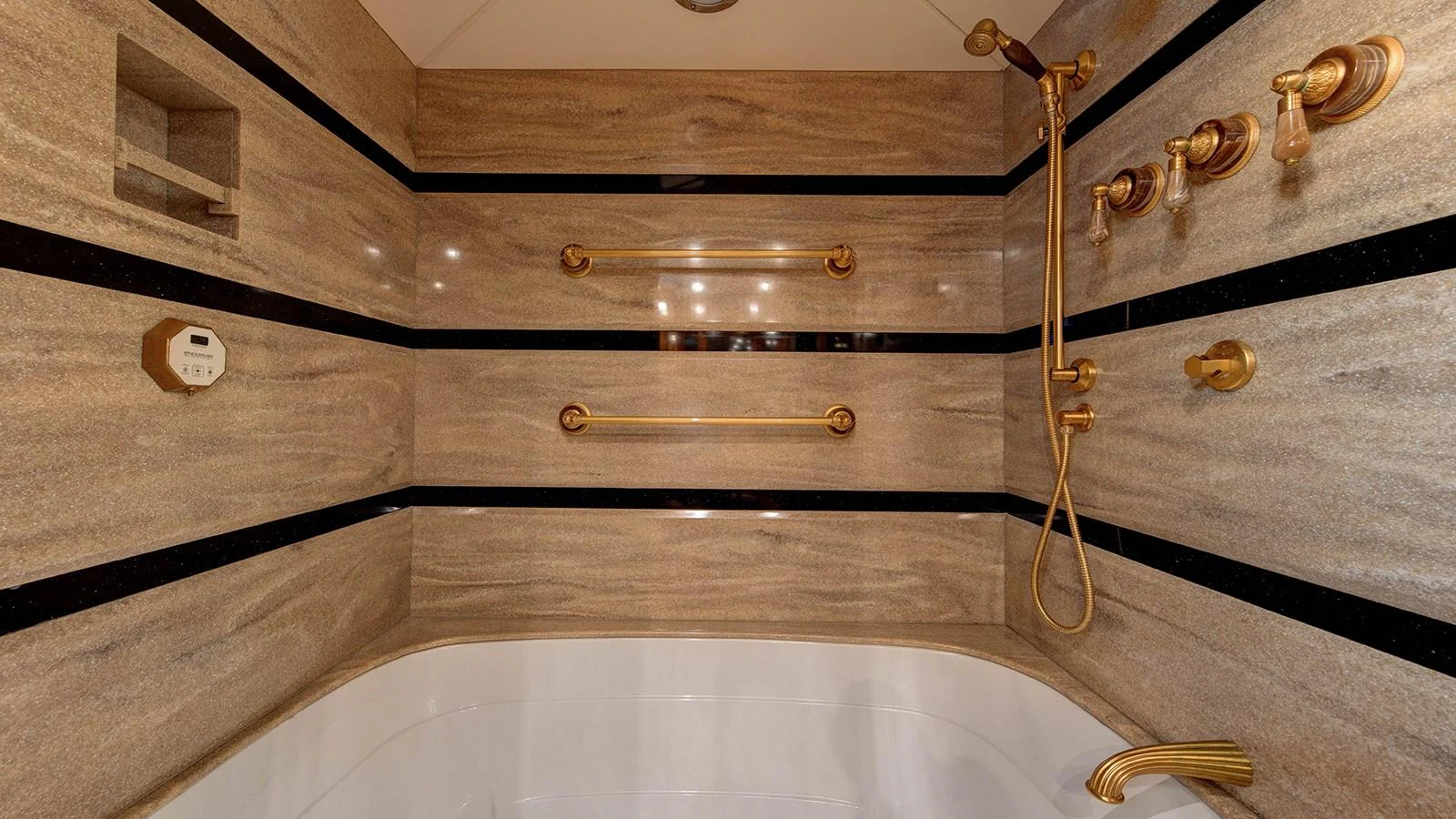 a brass instrument with a wooden handle aboard SIR JON II Yacht for Sale