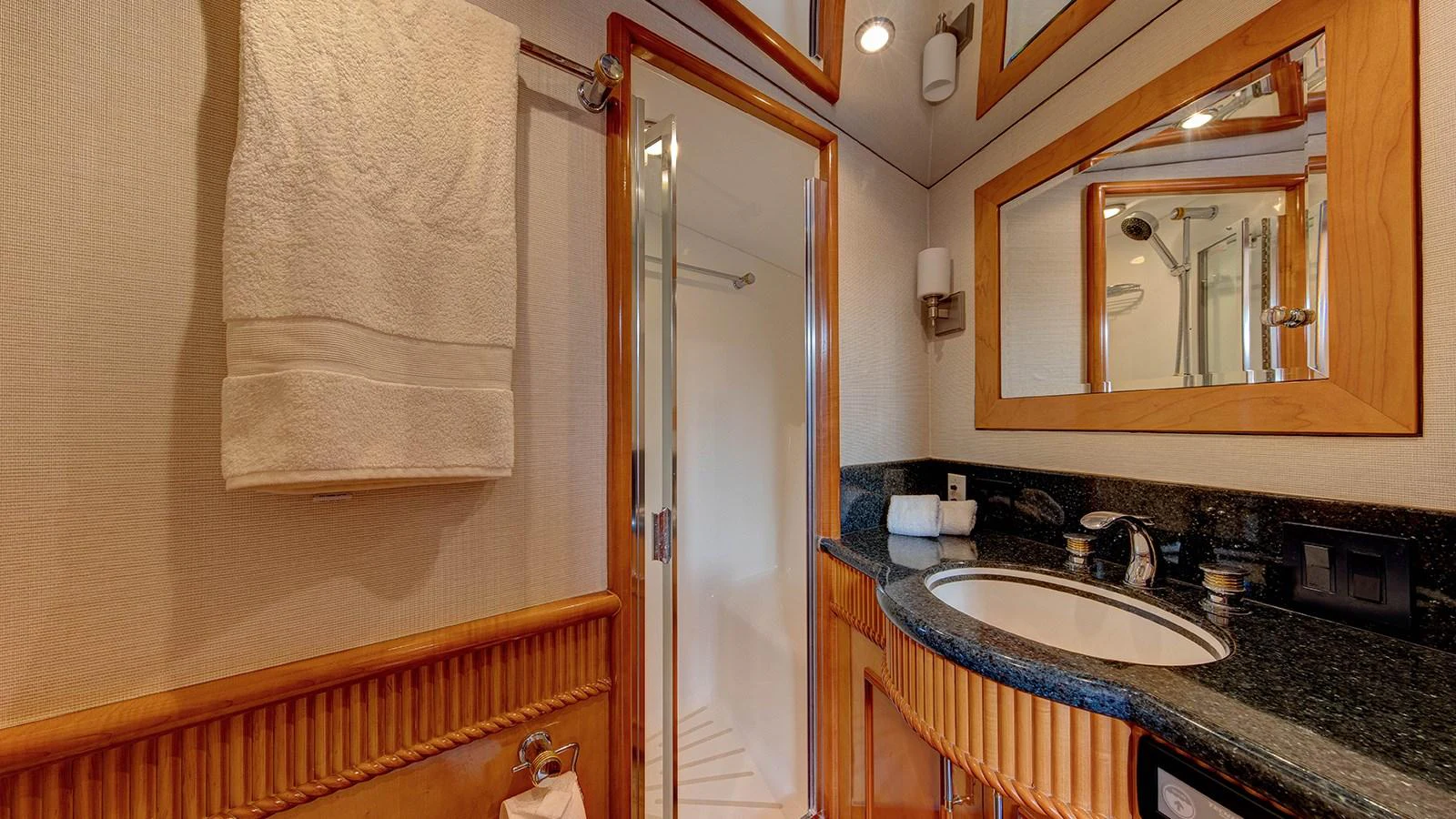 a bathroom with a sink and a mirror aboard SIR JON II Yacht for Sale