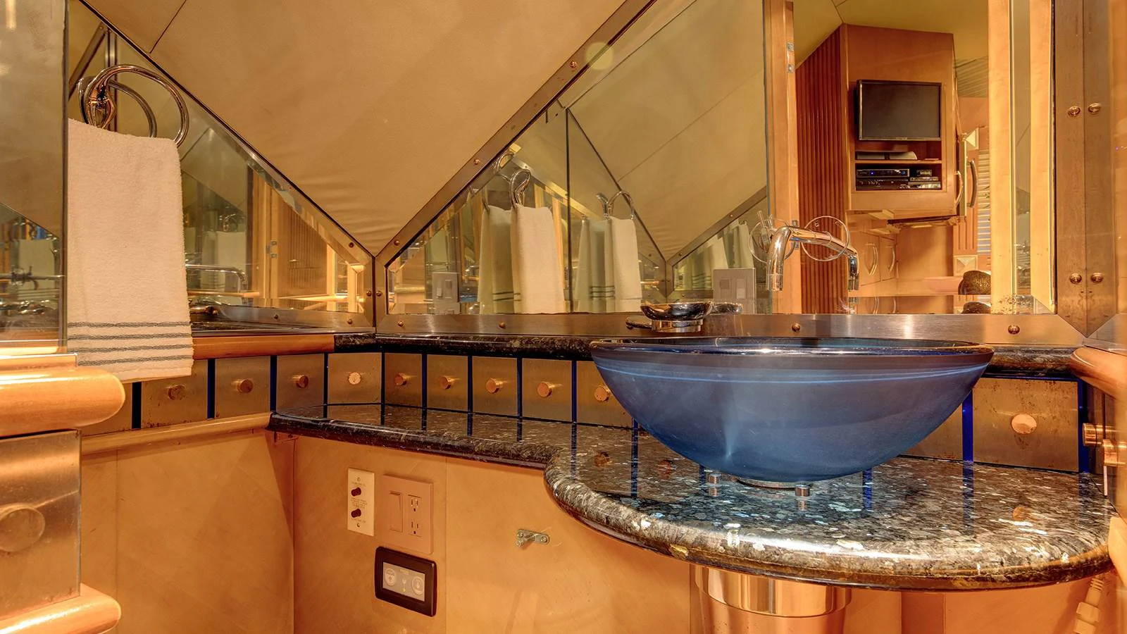 a kitchen with a large blue bowl aboard SIR JON II Yacht for Sale