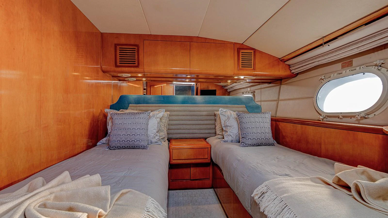 a room with two beds aboard SIR JON II Yacht for Sale
