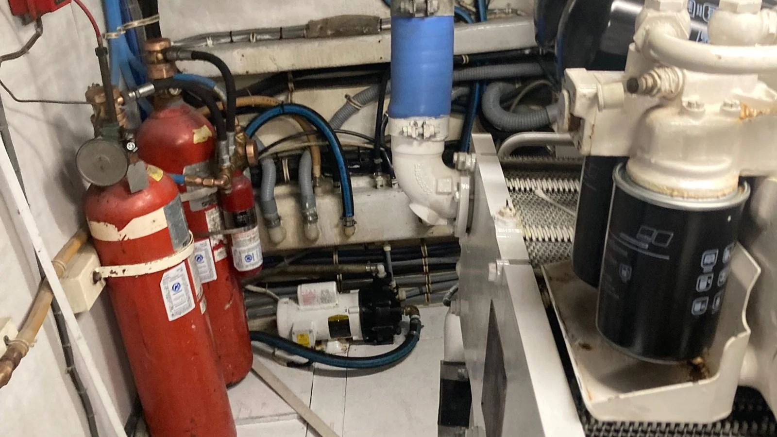 a machine with a red and blue cylinder aboard SIR JON II Yacht for Sale