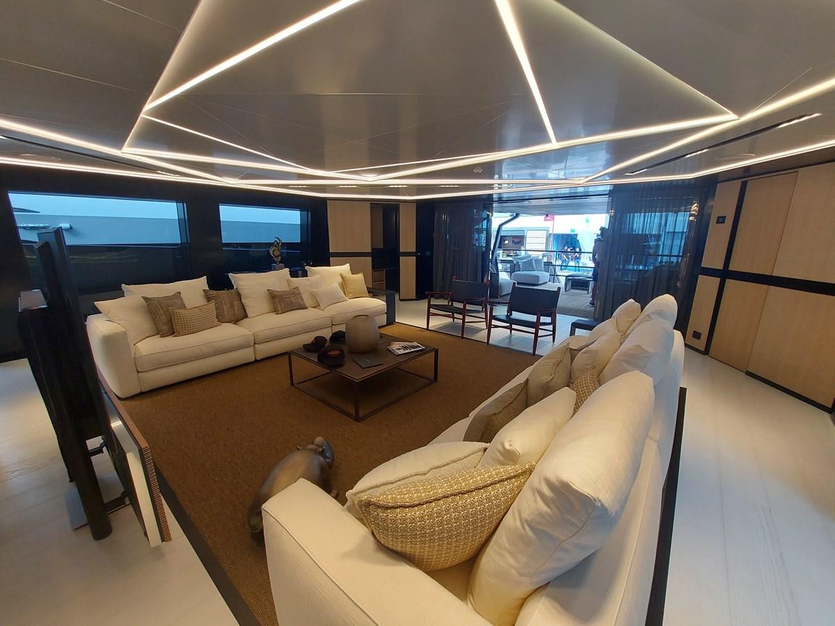 a room with couches and a table aboard M 125 Yacht for Sale
