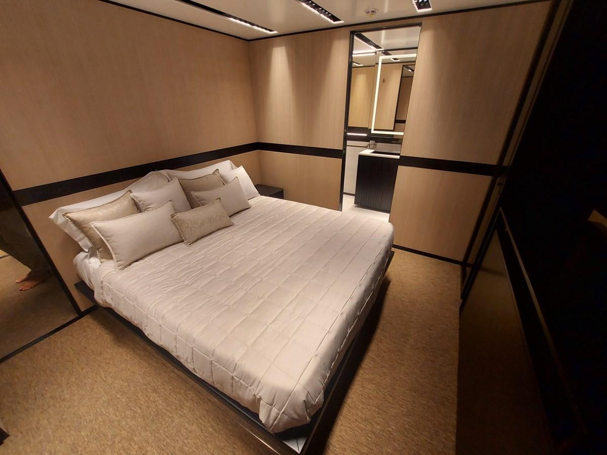 a bed in a room aboard M 125 Yacht for Sale