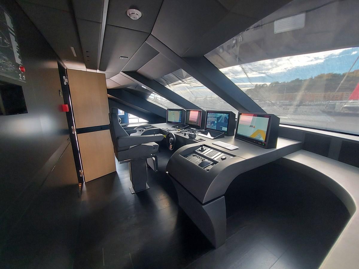 a room with a row of computers aboard M 125 Yacht for Sale