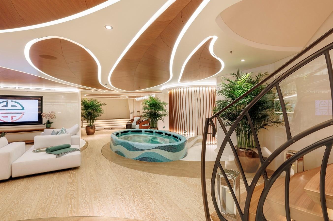 a room with a pool table and a plant in it aboard AHPO Yacht for Sale