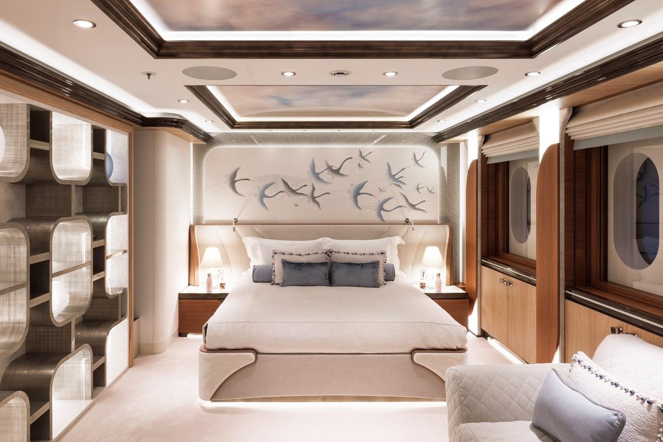 a room with a bed and a chair aboard AHPO Yacht for Sale