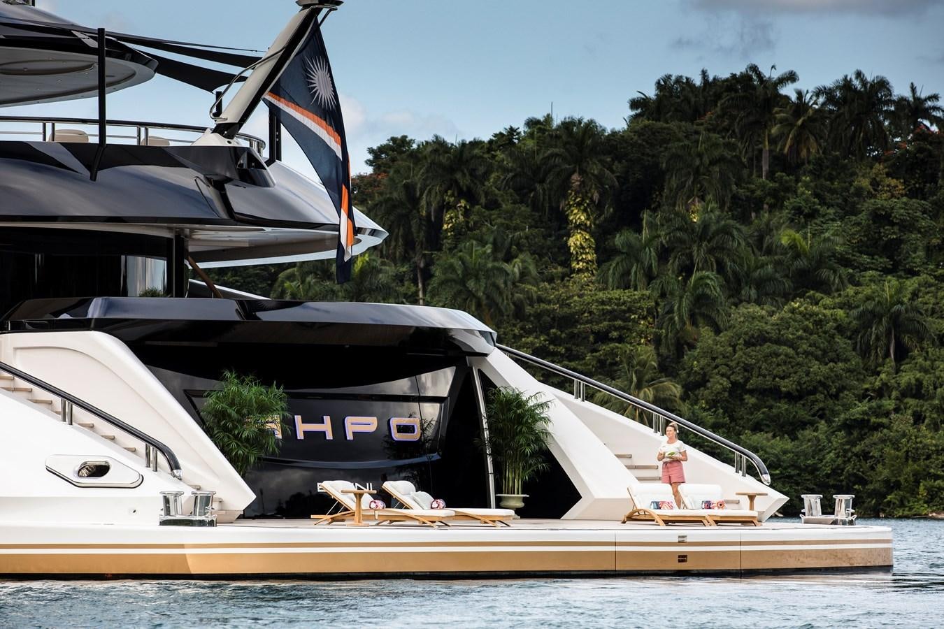 a person walking on a dock aboard AHPO Yacht for Sale