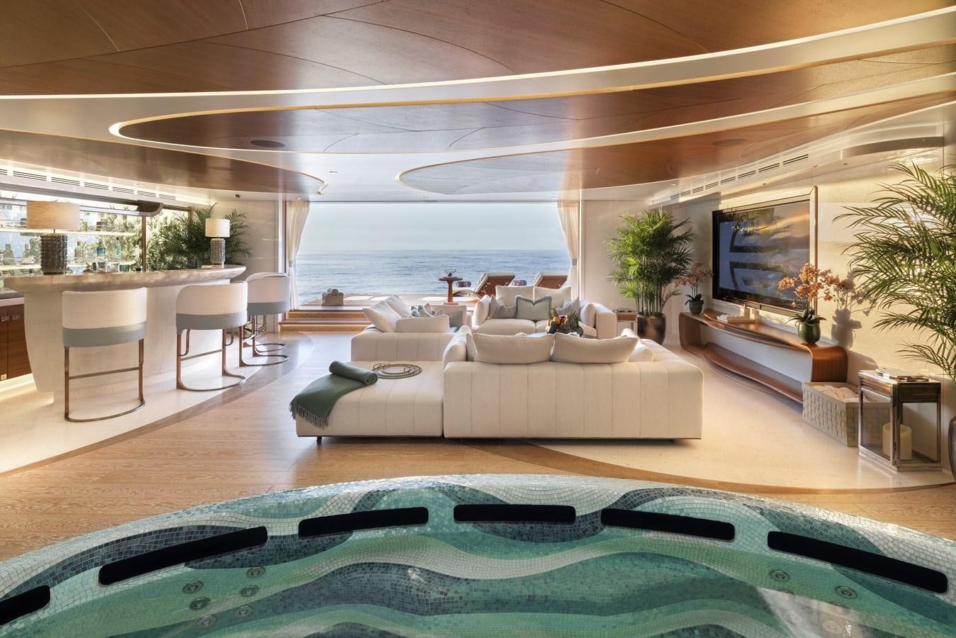 a living room with a large pool aboard AHPO Yacht for Sale