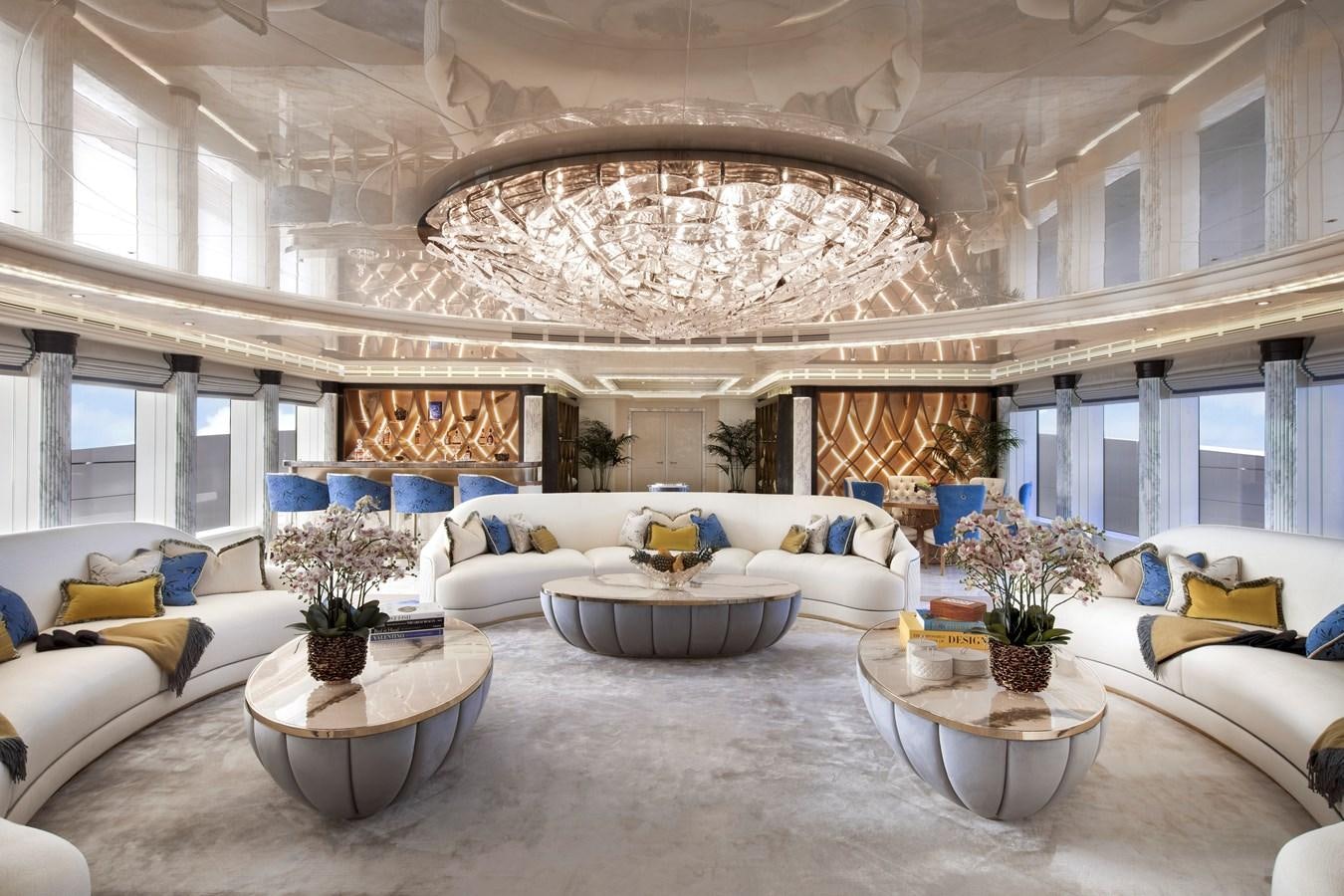 a large living room with a chandelier aboard AHPO Yacht for Sale