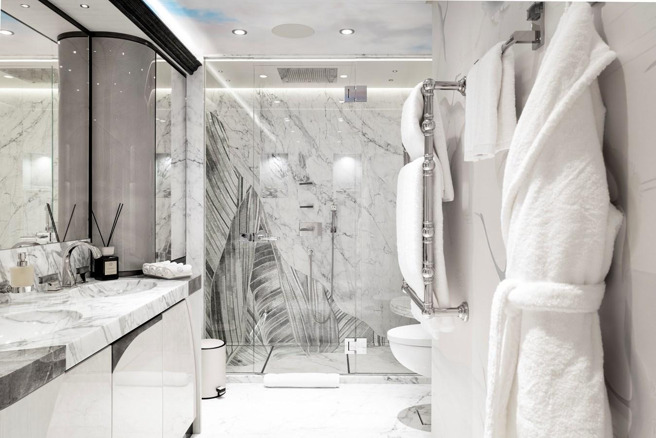 a bathroom with a robe on the wall aboard AHPO Yacht for Sale