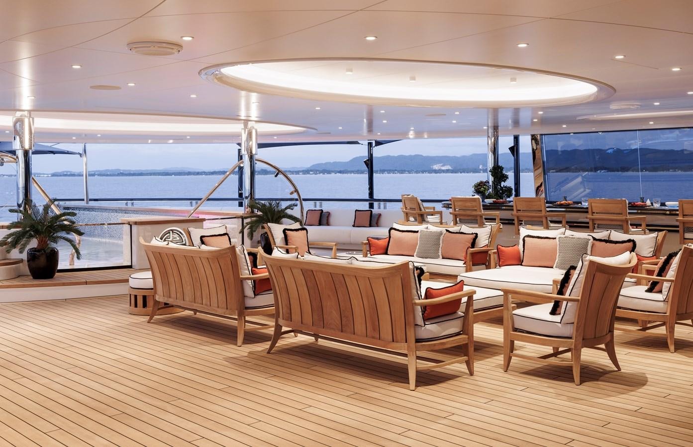 a room with chairs and tables aboard AHPO Yacht for Sale