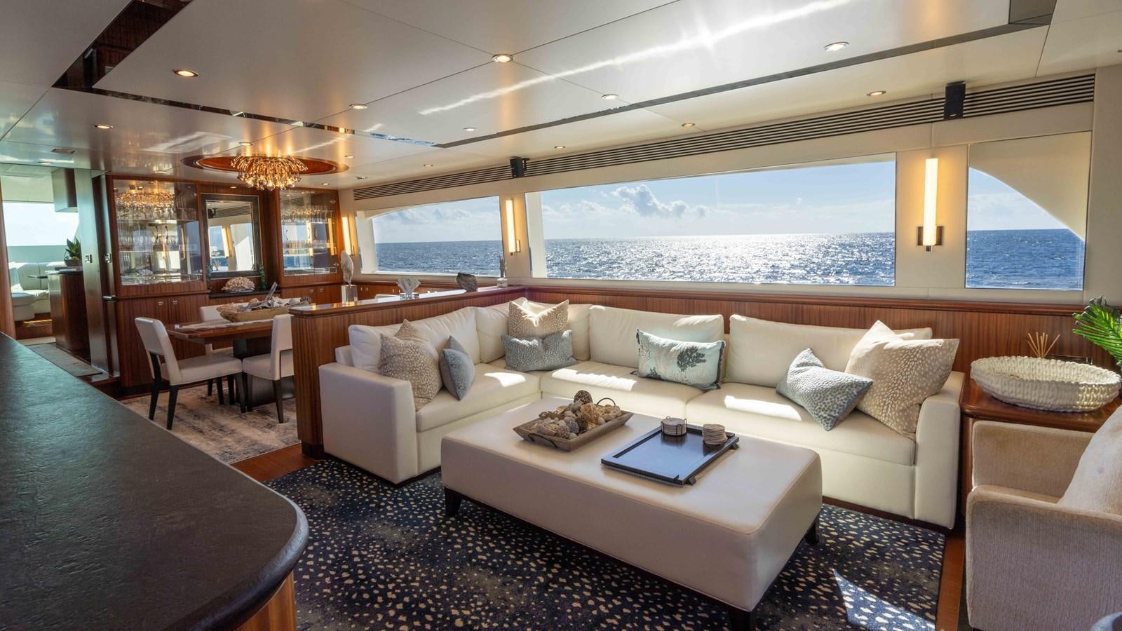 a living room with a large window aboard E84 Yacht for Sale