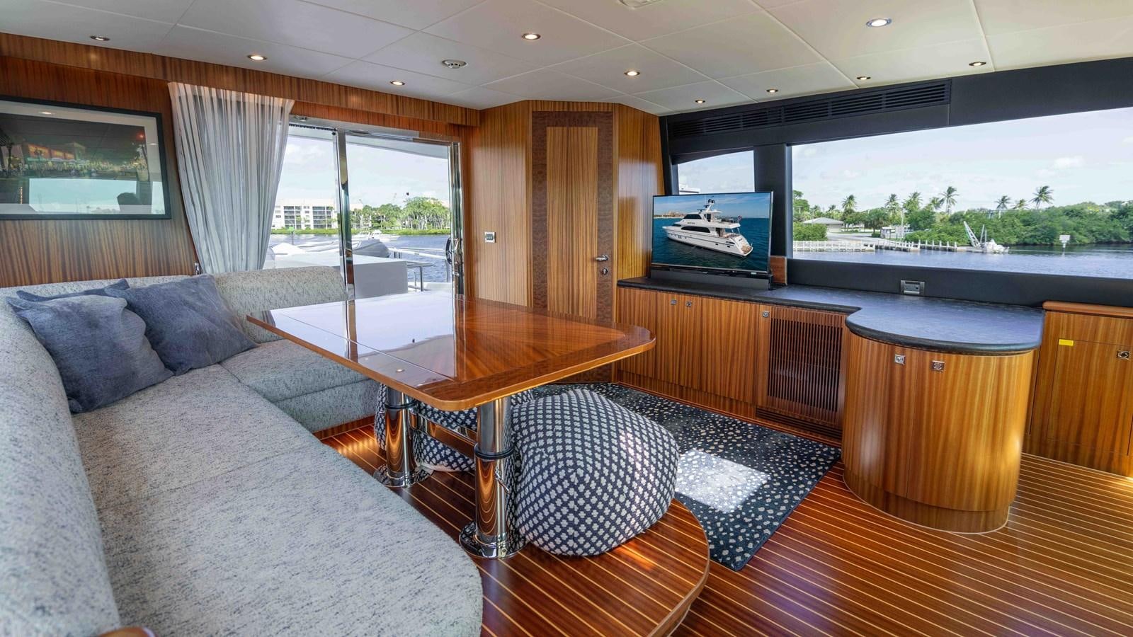 a living room with a couch and a table aboard E84 Yacht for Sale