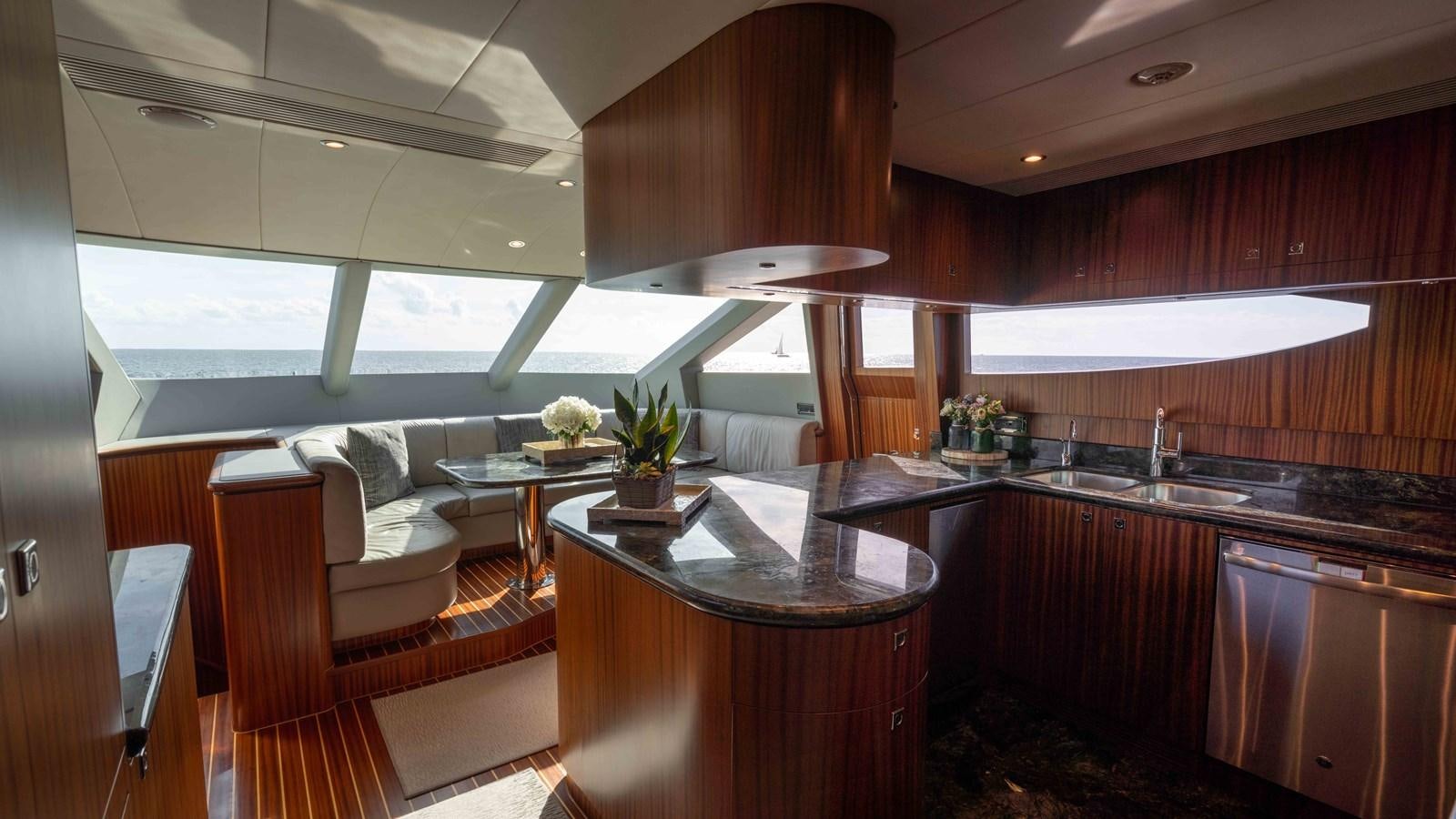 a kitchen with a large island aboard E84 Yacht for Sale