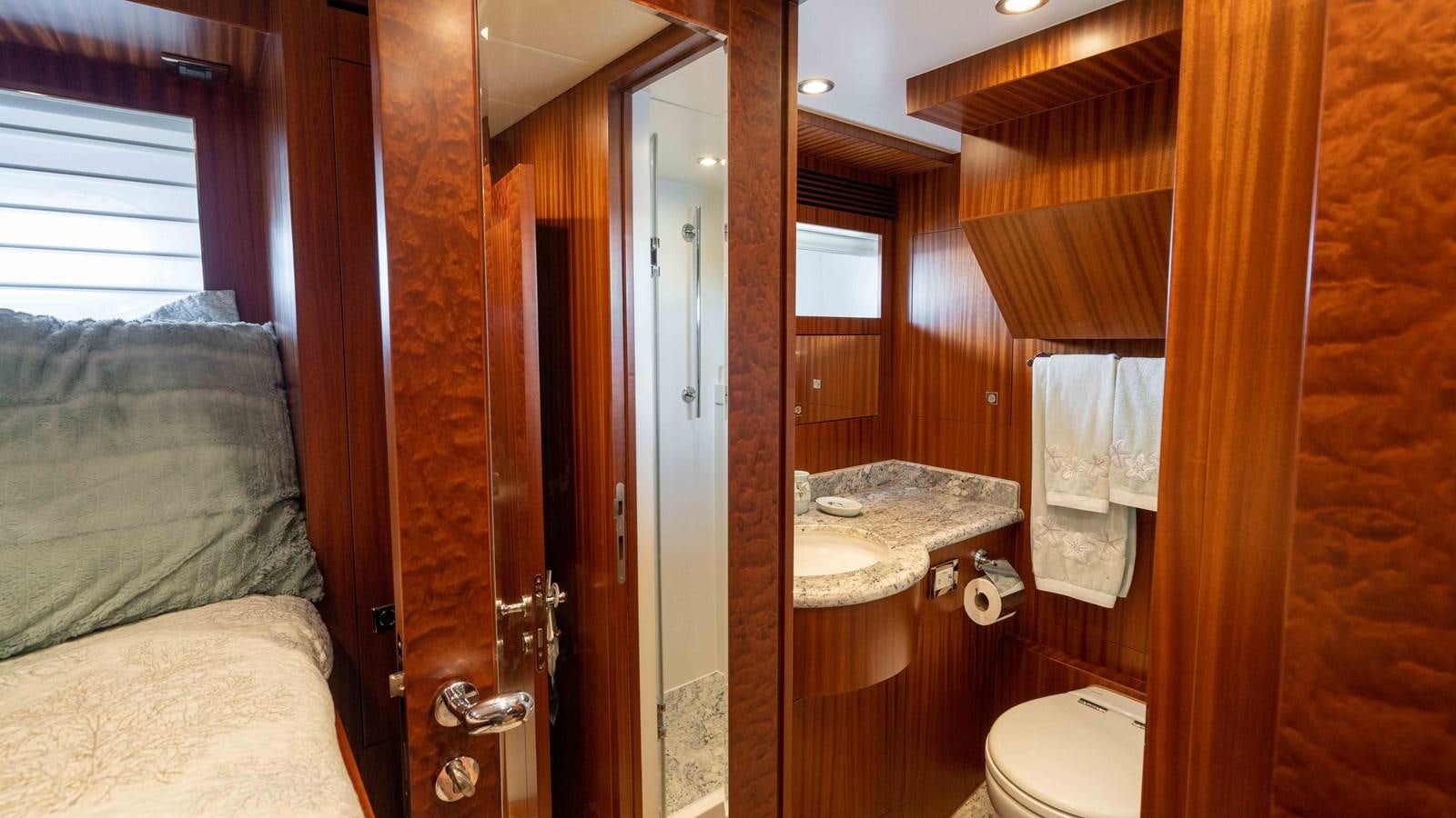 a bathroom with a bed and a sink aboard E84 Yacht for Sale