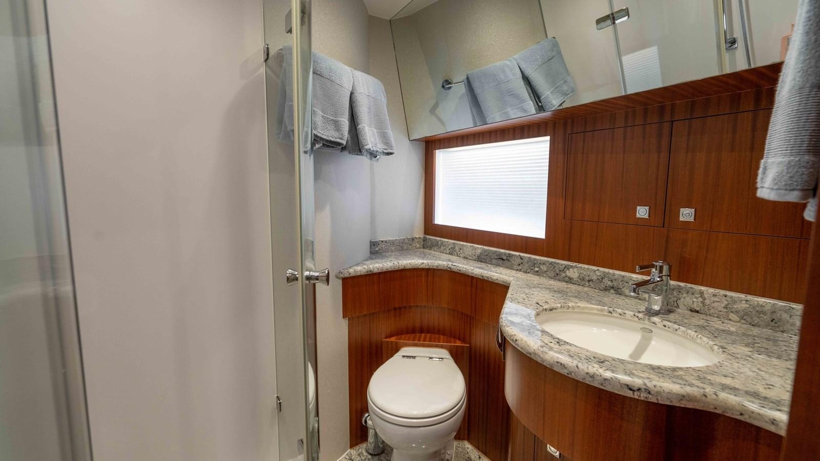 a bathroom with a sink and a toilet aboard E84 Yacht for Sale