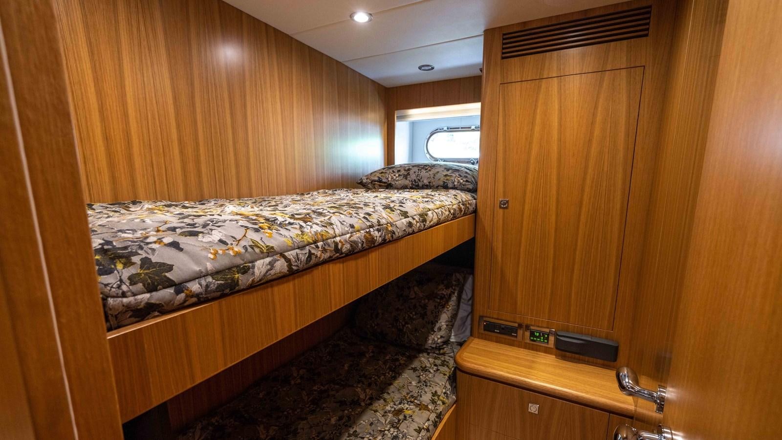 a bed in a room aboard E84 Yacht for Sale
