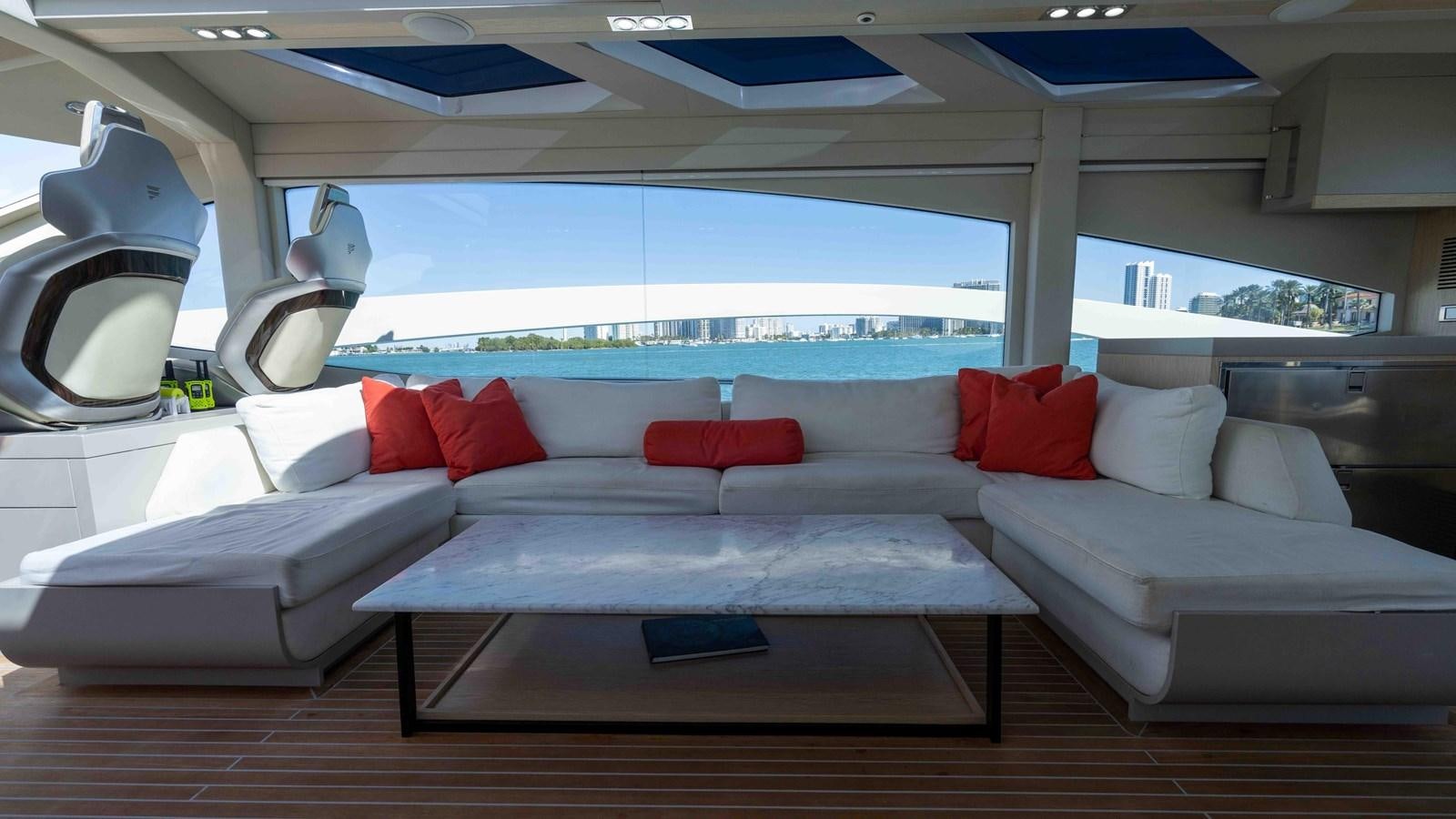 a living room with a couch and a table aboard ADONIS Yacht for Sale