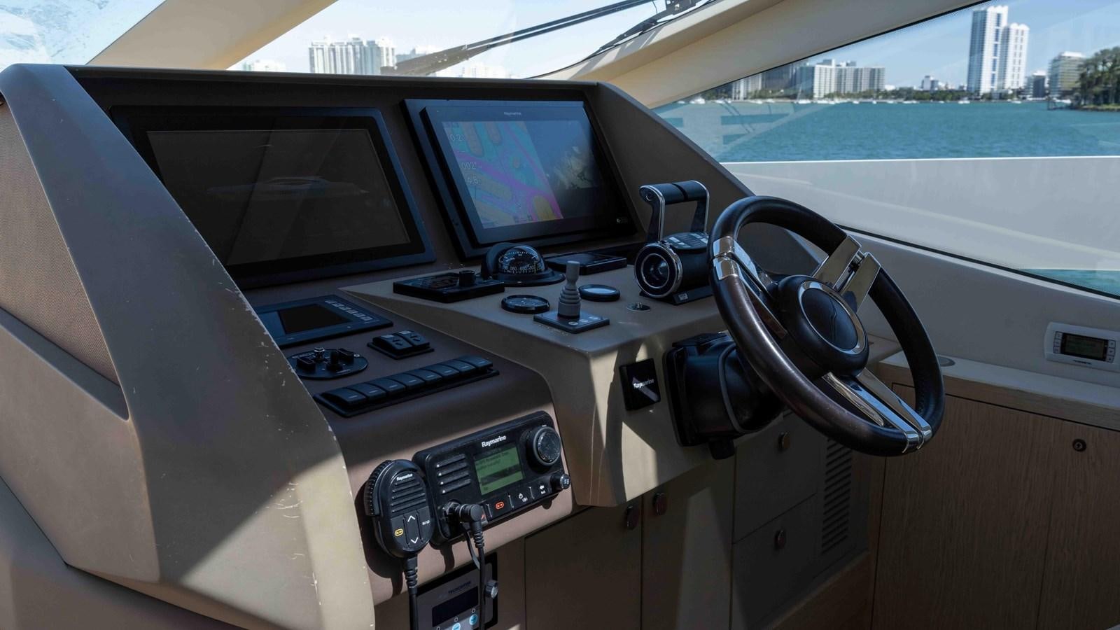 inside of a car aboard ADONIS Yacht for Sale