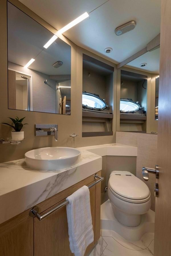 a bathroom with a sink and toilet aboard ADONIS Yacht for Sale
