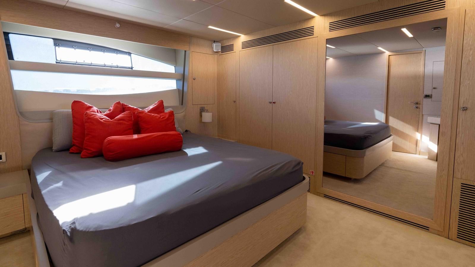 a bed in a room aboard ADONIS Yacht for Sale