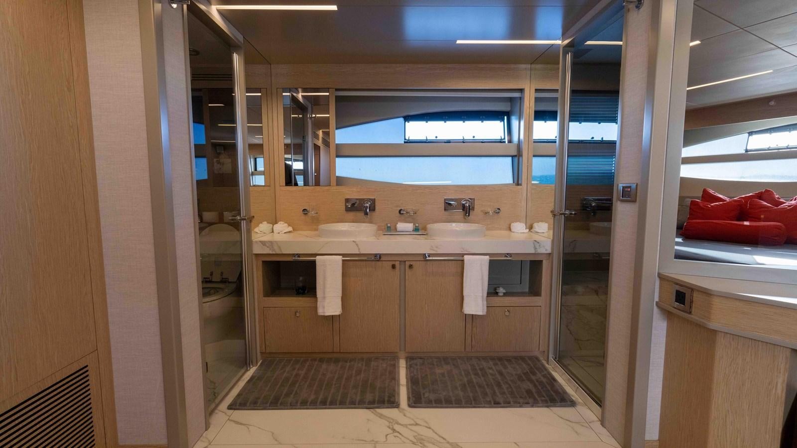 a bathroom with a sink and a mirror aboard ADONIS Yacht for Sale