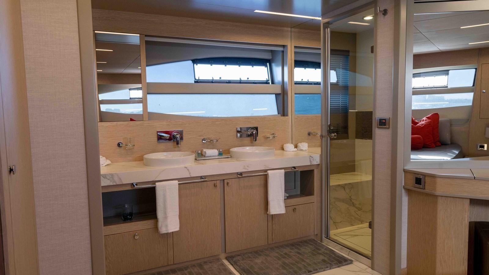a bathroom with a sink and a mirror aboard ADONIS Yacht for Sale
