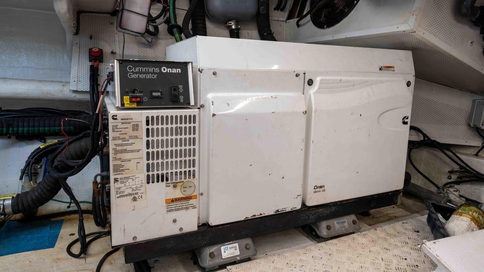 a white machine with a black and white panel aboard ADONIS Yacht for Sale