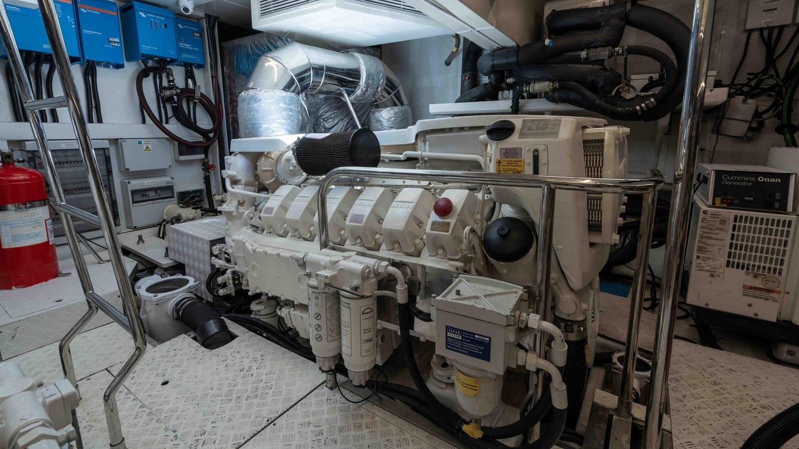 a machine with a large metal cylinder aboard ADONIS Yacht for Sale