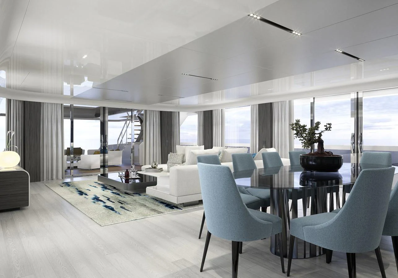 a room with a table chairs and a plant in the middle aboard LEGASEA Yacht for Sale